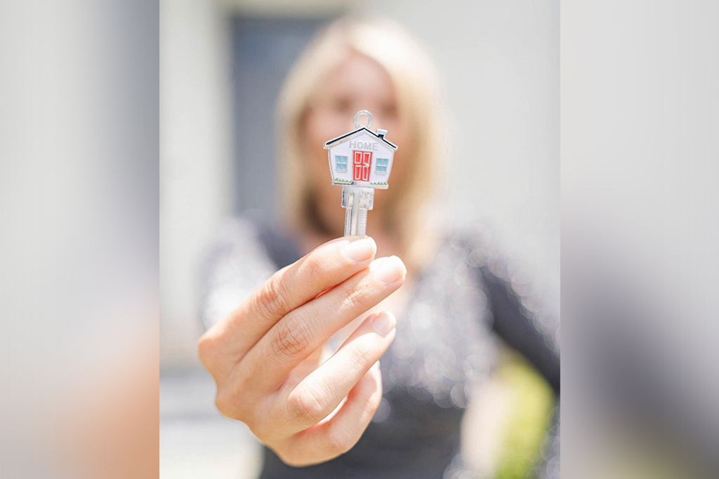 Woman Holding House Key